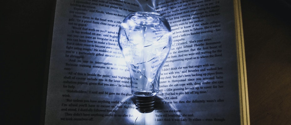 Light bulb within a book